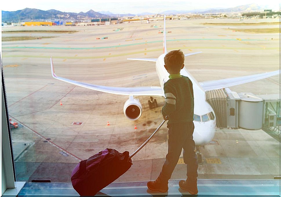 Boy with suitcase at the airport