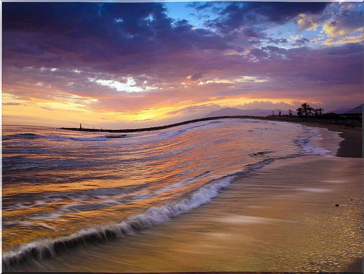 Beautiful sunset on the beach of Cabopino, Marbella.