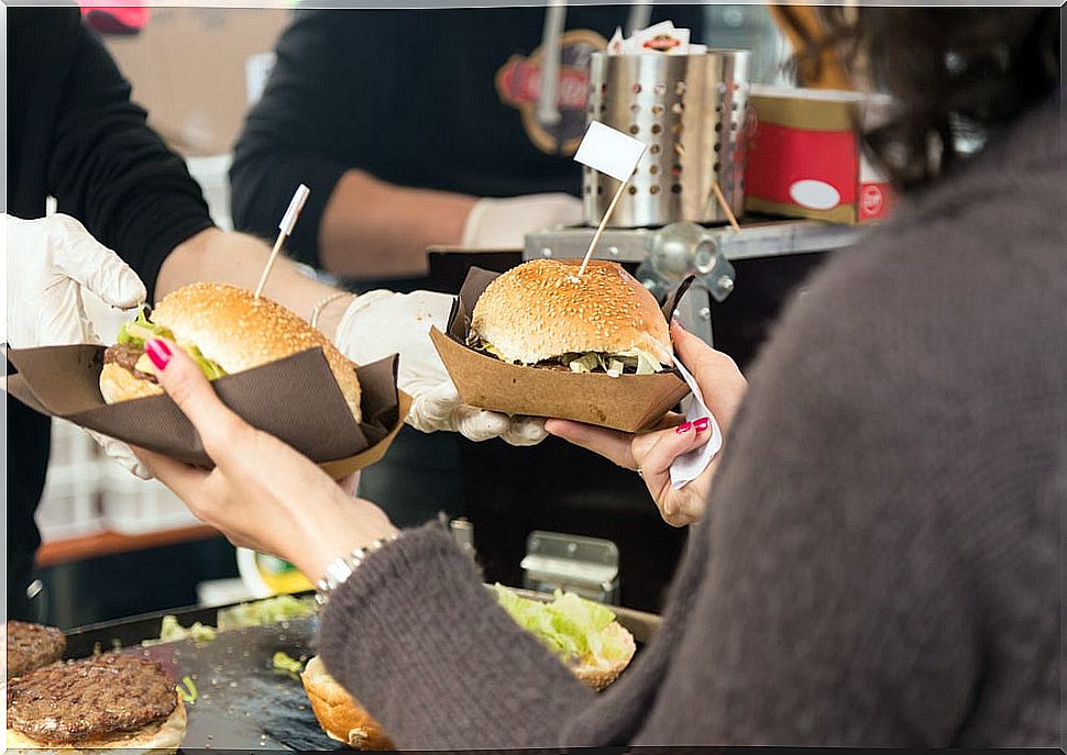 Woman buying hamburgers